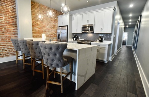 Central Business District Hotel | Luxurious Charm: Elegance with Exposed Brick Walls in New Orleans' CBD