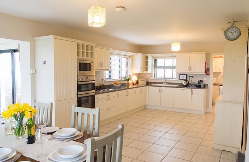 Quilty House | Luxurious family home with spectacular views close to shops, pub and beaches