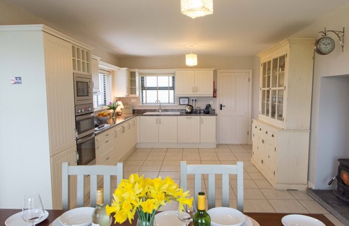 Quilty House | Luxurious family home with spectacular views close to shops, pub and beaches