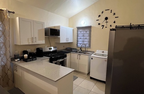 Portmore House | Luxury 2-Bedroom Retreat in Gated Community – Near Beaches & City Fun