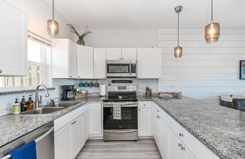 Surfside Beach Condo | Luxury Beachfront Condo with Covered Deck Steps From Beach & Golf Cart Rental
