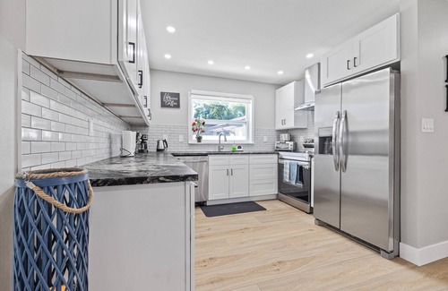 Orchid Lake Village House | Luxury Pool Home! Heated Pool, Fire Pit, Fishing Dock & More – Relaxation & Fun Await!