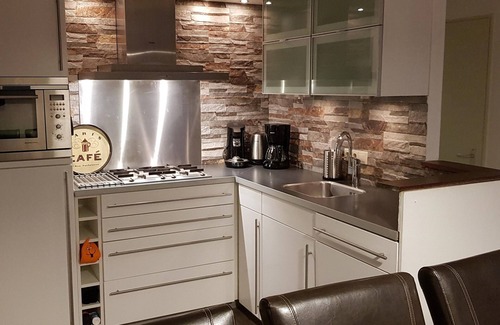 Lochem House | Luxury vacation home with bar billiards and sauna in wooded area