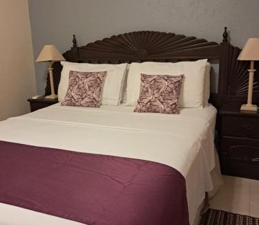 Charnocks Apartment | Michand Guest Apartments- Cozy one or two bedroom- 5 walk minutes from airport 10 mins drive to Oistins or beach