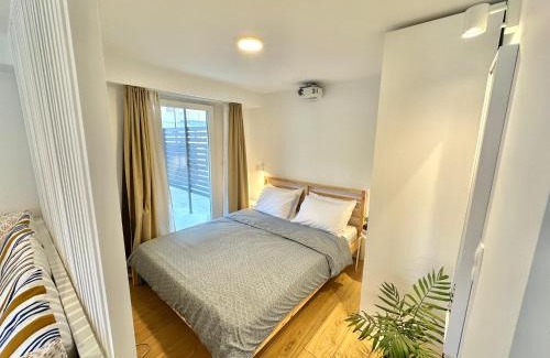 Olymbiaki Akti House | Minimalist Seaside Apartment with Private Patio and Parking - Blue Zone Homes