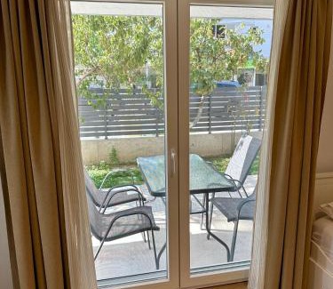 Olymbiaki Akti House | Minimalist Seaside Apartment with Private Patio and Parking - Blue Zone Homes