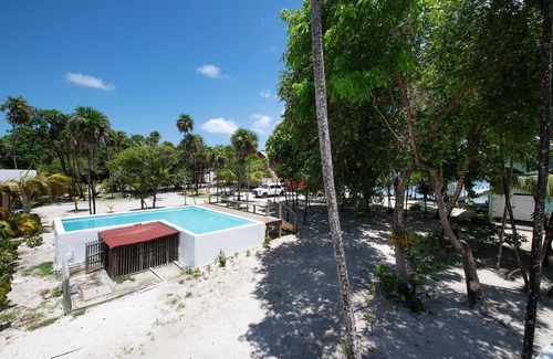 Roatan House | Modern 2 Bedroom Beachfront Home - Steps from the Sea w/Patio, Shared Pool&Dock