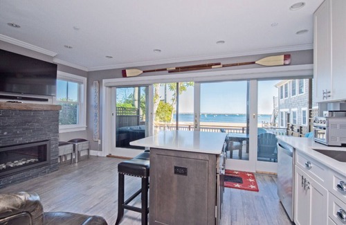 Commercial Street Condo | Modern Beachfront Escape - Steps from Ferry - Private Deck - Waterfront