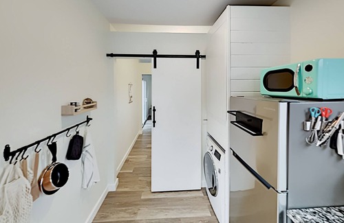 Spicewood House | Modern Container Home with Wraparound Deck & Covered BBQ Area