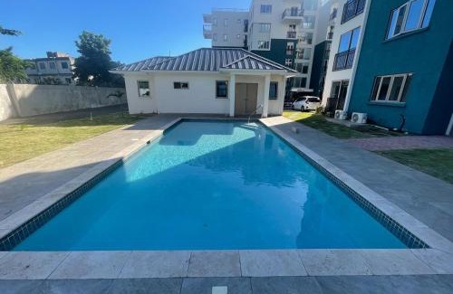 Eden Gardens Apartment | Modern Kingston Apartment Suite With Pool & Ocean View