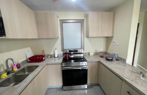 Eden Gardens Apartment | Modern Kingston Apartment Suite With Pool & Ocean View