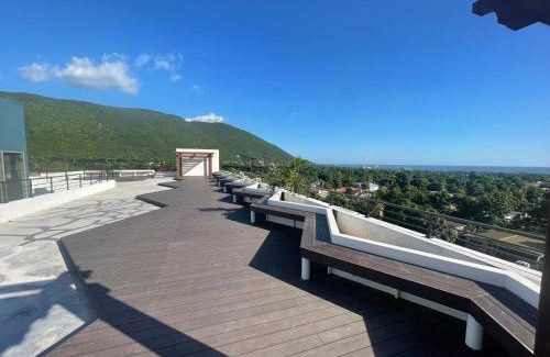 Eden Gardens Apartment | Modern Kingston Apartment Suite With Pool & Ocean View