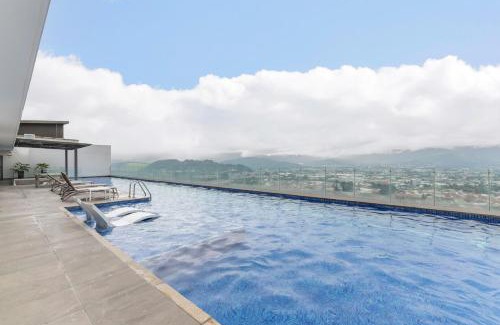 Curridabat Apartment | Modern Oasis iFreses, 18th floor! AC, TV and Pool