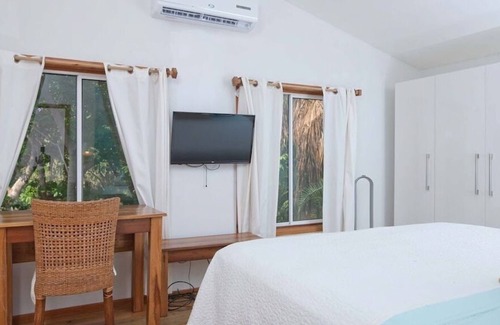 Antoneys Cay Condo | Modern Sandy Bay Condo by the beach with community pool and pier