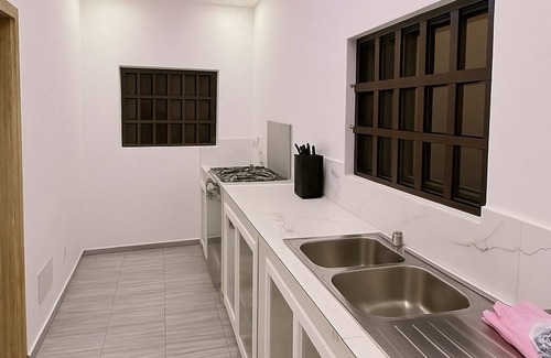 Agbodrafo Apartment | Modern vacation apartment with washing machine and king-size bed
