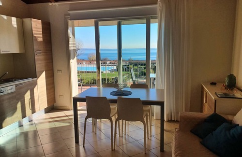 Manerba del Garda Apartment | Montecolo Resort three-room apartment with splendid lake view, swimming pool