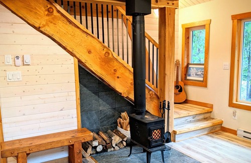 Comox Valley Cabin | Mountain oasis, Custom timber A-frame with hot tub and fire pit. Pet friendly.