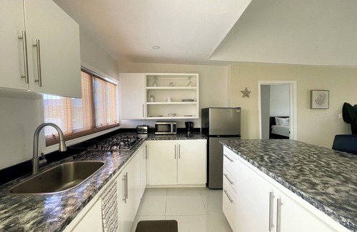 Jimmy Hill House | Newly Built 2-Bedroom Villa Short Walk From Beach & Minutes away from Airport!