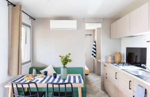 Marina di Montalto House | Nice and welcoming mobile home located near the beach with air conditioning of approximately 24 m2 composed of a living room, kitchenette with gas stove, fridge with freezer, pots and pans.A bedroom with a double bed and another bedroom with two single b