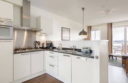 Zeewolde Apartment | Nice apartment for 4 people with pool, hot tub, WIFI, TV, balcony and parking