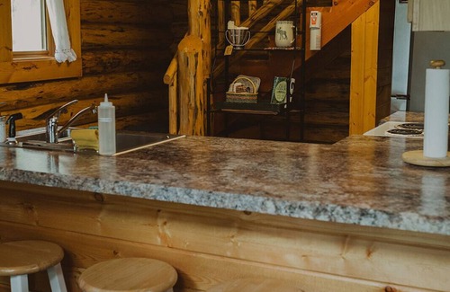 Seeley Lake Cabin | Nordic Cabin at Tamaracks Resort, a cozy log cabin with views of Seeley Lake.