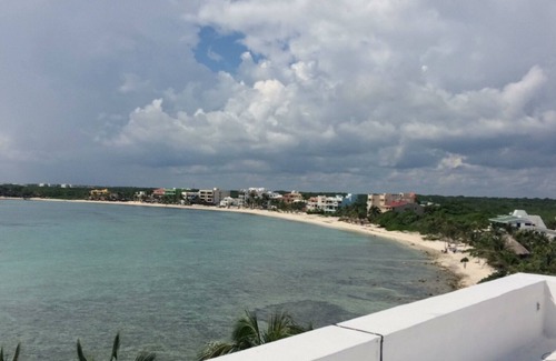 Akumal Condo | Oceanfront double size beach condo in La Sirena condominium