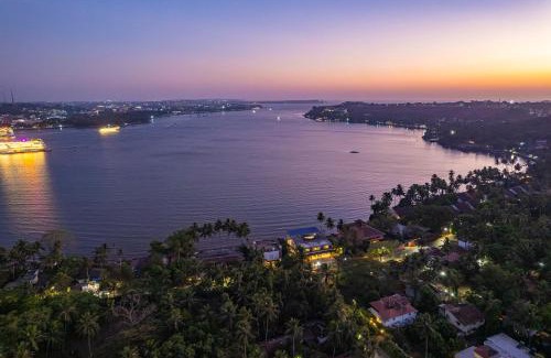 Verem Villa | Oceanic Sunsets with River View, Comp Breakfast & Infinity Pool at StayVista
