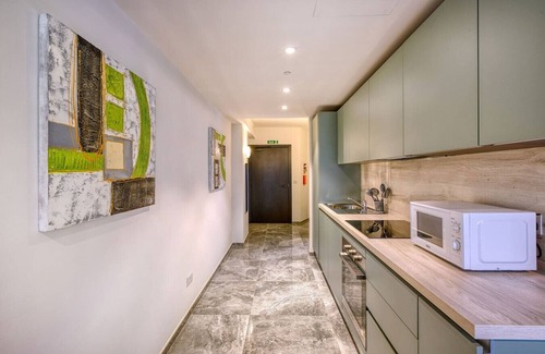 Paceville Apartment | Official Mercury Suites | With Rooftop Pool Access