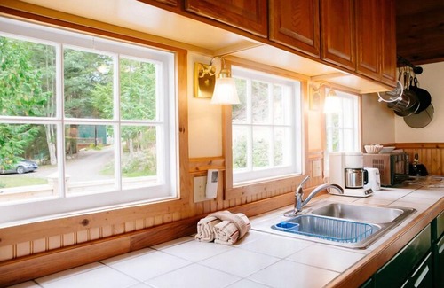 Olga Cottage | Old Island Charm with Stunning Mountain Views, Perched above Our Private Beach