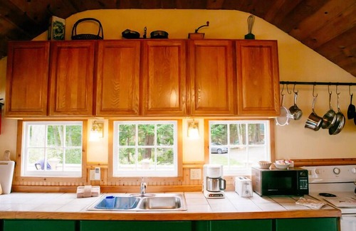 Olga Cottage | Old Island Charm with Stunning Mountain Views, Perched above Our Private Beach