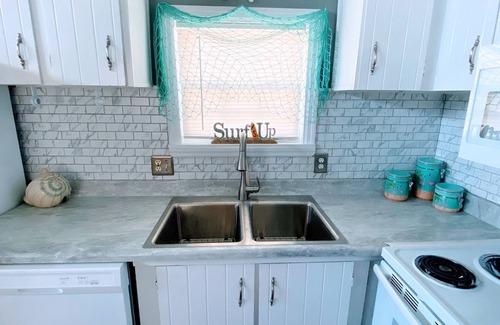 Garden City House | One minute drive to beach with golfcart! Updated, beach decor & clean!