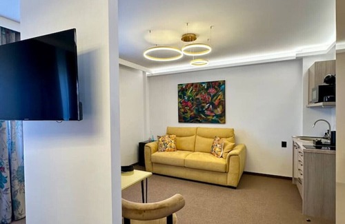 Satu Mare Apartment | Onyx Deluxe King Studio by Eclectic 6