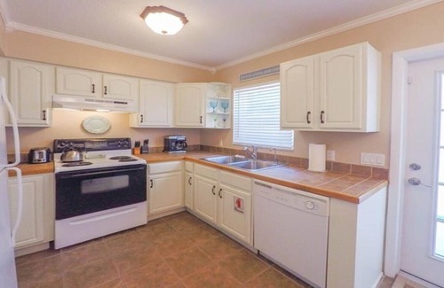 Holmes Beach Villa | Palm Oasis East Villa, Shared Heated Salt Pool, Steps to the Beach, Ground Level