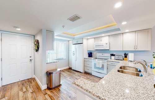 Madeira Beach Condo | Parrot's Cove | Condo in Madeira Beach with a heated pool