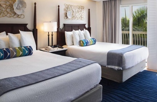 St. Pete Beach Hotel | Perfect for Groups! With Kitchenette and Stunning Tropical View, Onsite Pools!