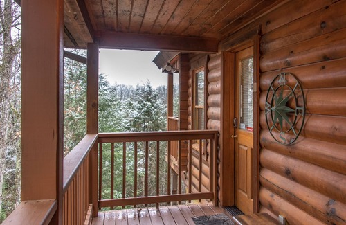 Gatlinburg - Pigeon Forge Cabin | Pet-friendly retreat with tree-top views, a hot tub + an arcade loft!