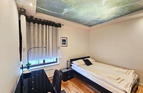 Torun Apartment | Piernikowy Apartament 52 by Rentoom