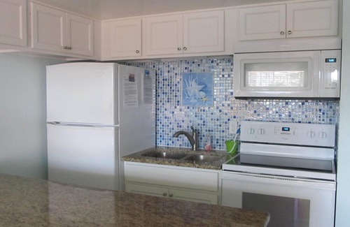 Sunset Beach Condo | Pool, Fishing Dock, and steps to the Beach! Awesome view of Boca Ceiga Bay.