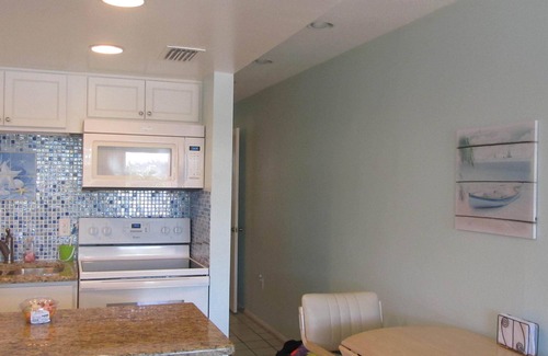 Sunset Beach Condo | Pool, Fishing Dock, and steps to the Beach! Awesome view of Boca Ceiga Bay.