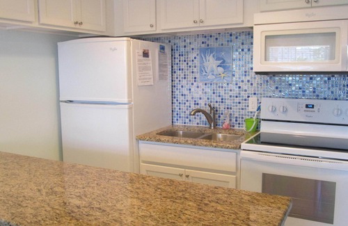 Sunset Beach Condo | Pool, Fishing Dock, and steps to the Beach! Awesome view of Boca Ceiga Bay.