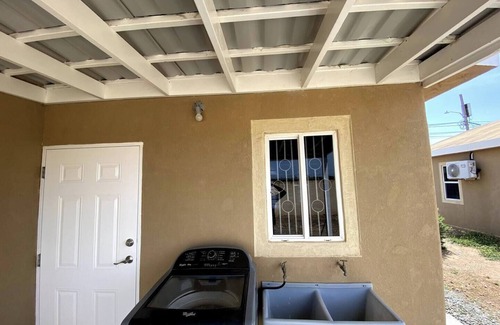 Caribbean Estates House | Portmore Haven: Secure Retreat with Beach Access
