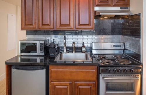 Downtown Reno Condo | Prime Location Studio Downtown! Top Amenities: Gym, Pool, Hot Tub & More!