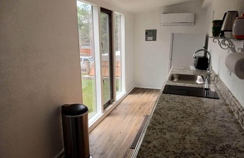 Greenwood Village House | Private entrance master suite with a kitchenette