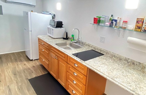 Greenwood Village House | Private entrance master suite with a kitchenette