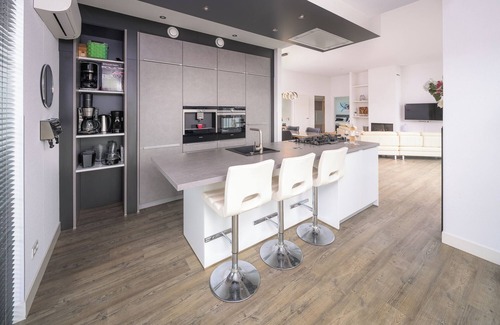 Zeewolde House | Private Finnish sauna, Luxury kitchen with bean coffee maker and large gas stove, With swimming jetty on the water.