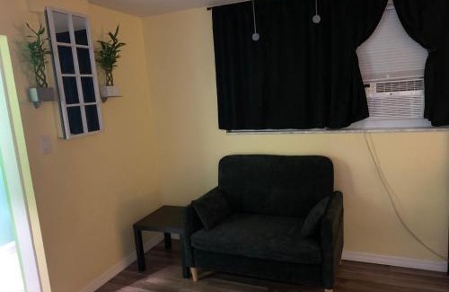 Pinellas Park House | Private suite with small kitchen private bathroom entrance porch and driveway