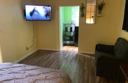 Pinellas Park House | Private suite with small kitchen private bathroom entrance porch and driveway