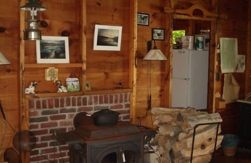 Farmington Cabin | Private three season cabin nestled in woods on shore of pristine Maine lake