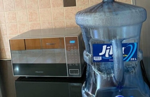 Kampala House | Quiet and peaceful hidden gem surrounded by lush greenery and vibrant flowers.n