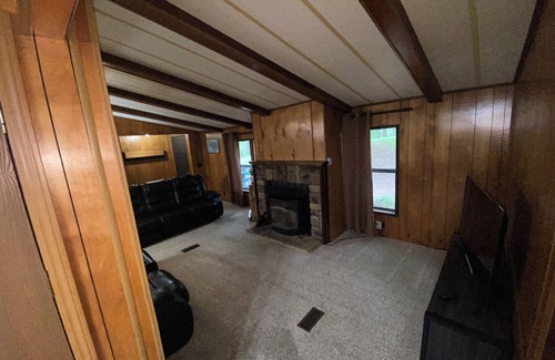 Flint Creek House | Quiet cabin in the woods w/access to pools, river, & lakes in gated community!